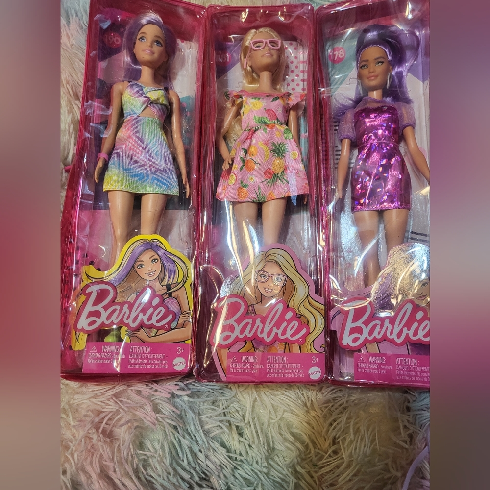 Three Barbie fashion dolls